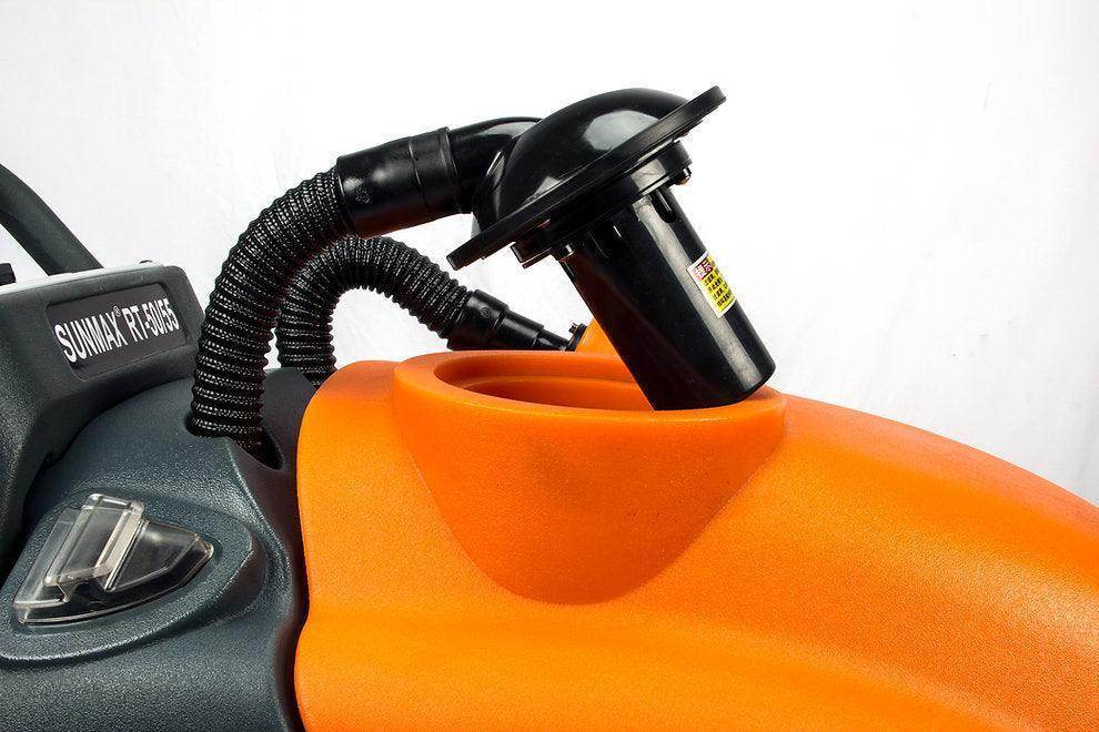 Close-up of orange and black 22-inch brush scrubbing path battery-powered floor scrubber machine for warehouses